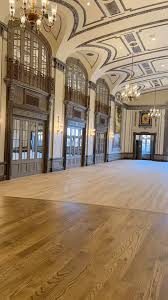 Commercial hardwood floor refinishing in a Cleveland event hall