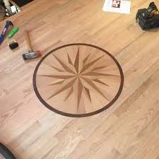 Custom compass medallion hardwood floor inlay